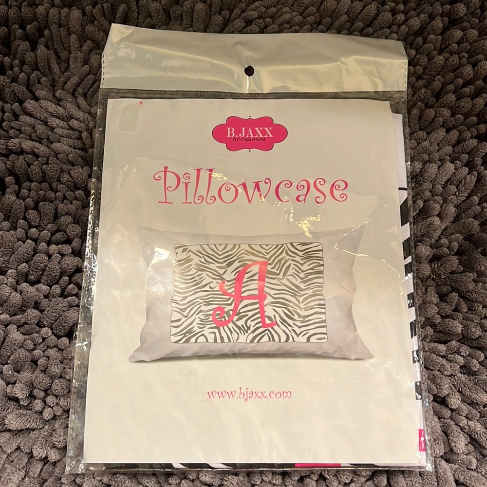 New in package! Standard size pillowcase with a letter “A”